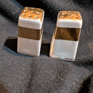 Salt & Pepper shakers with gold band.